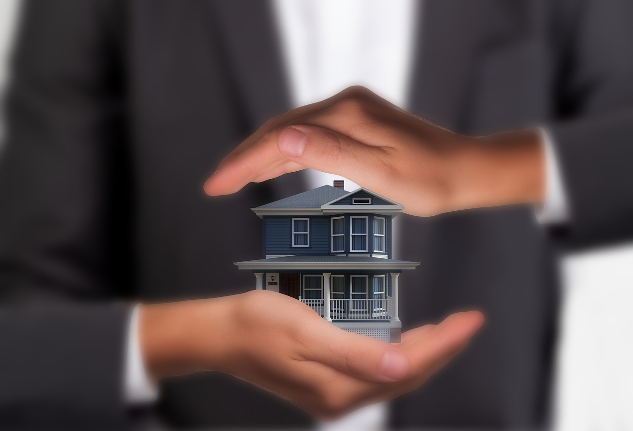 Man hands holding house - Burglary Insurance Claim